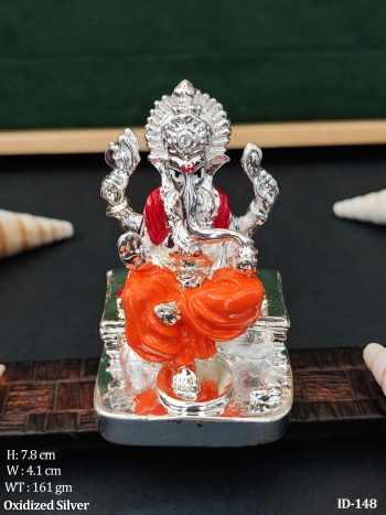 Silver Ganesh Statue with Orange Traditional Wear